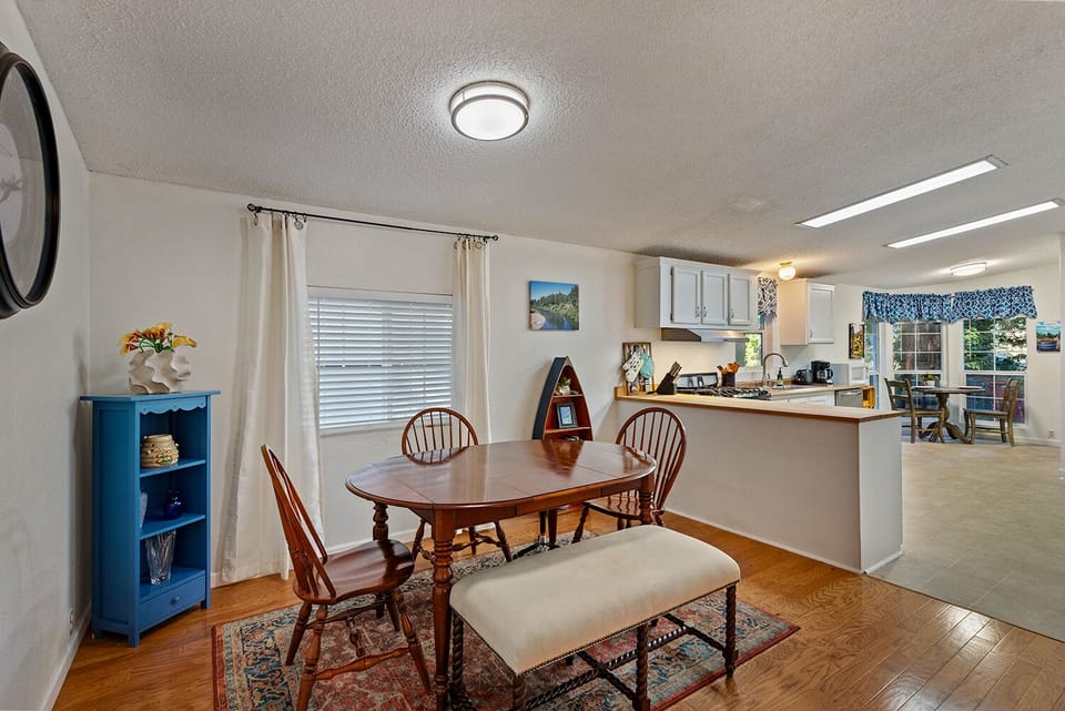 Open and airy - the dining area and kitchen look out to Austin Creek.