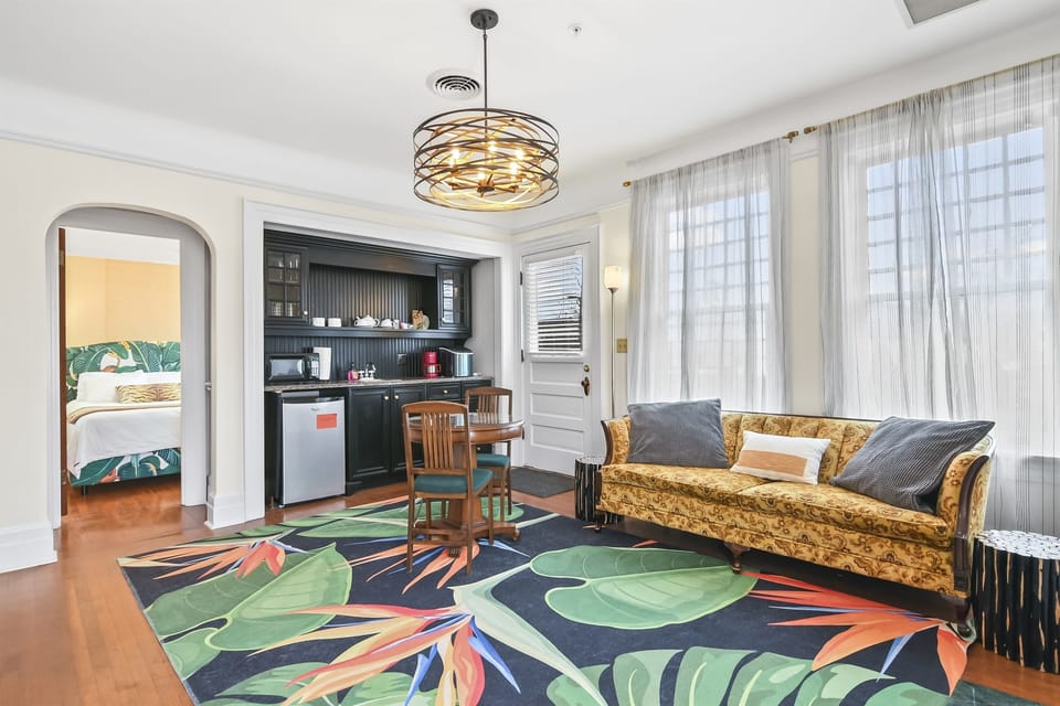 Living Room with Couch, Dining / Reading Area, and Kitchenette