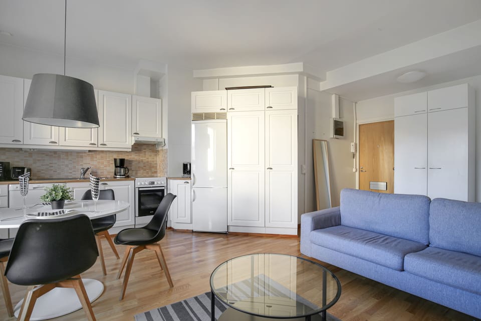 Basic Apartment, City View | Living area | Flat-screen TV