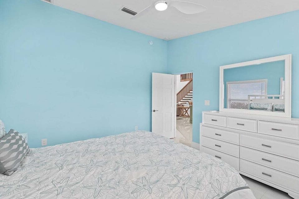 Bedroom 2 on the second level featuring a queen bed.