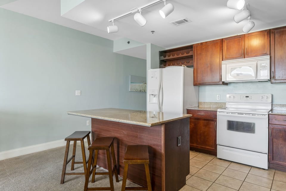 kitchen with a breakfast bar and seating for three