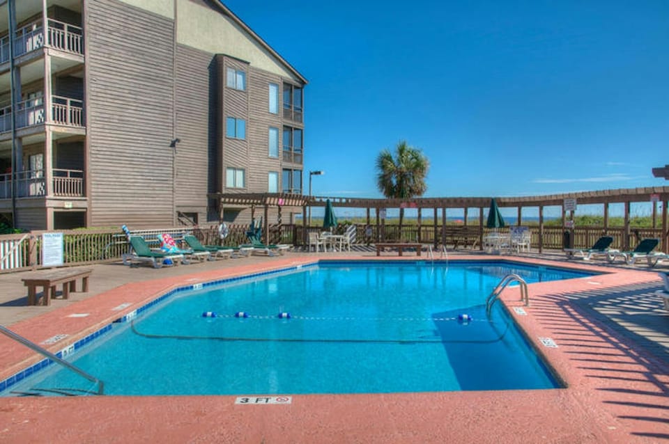 Catch some rays while the kids splash in the pool.