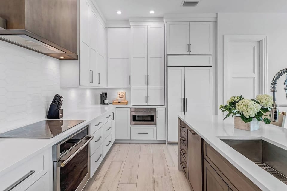 Fully stocked Chef's Kitchen with quartz countertops for preparing a gourmet meal