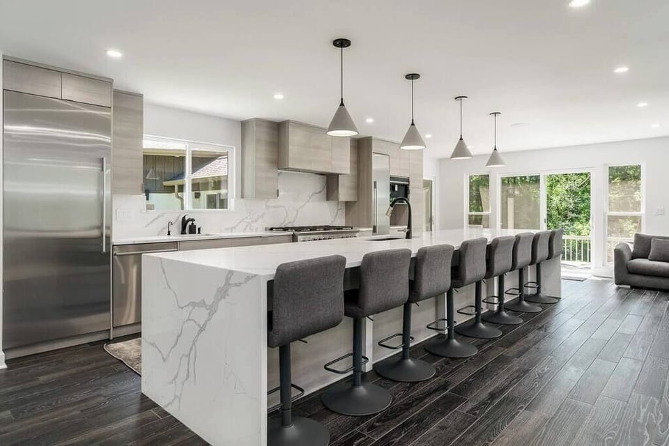 Contemporary sophistication meets culinary function in this gourmet kitchen, where gatherings are as grand as the meals prepared.