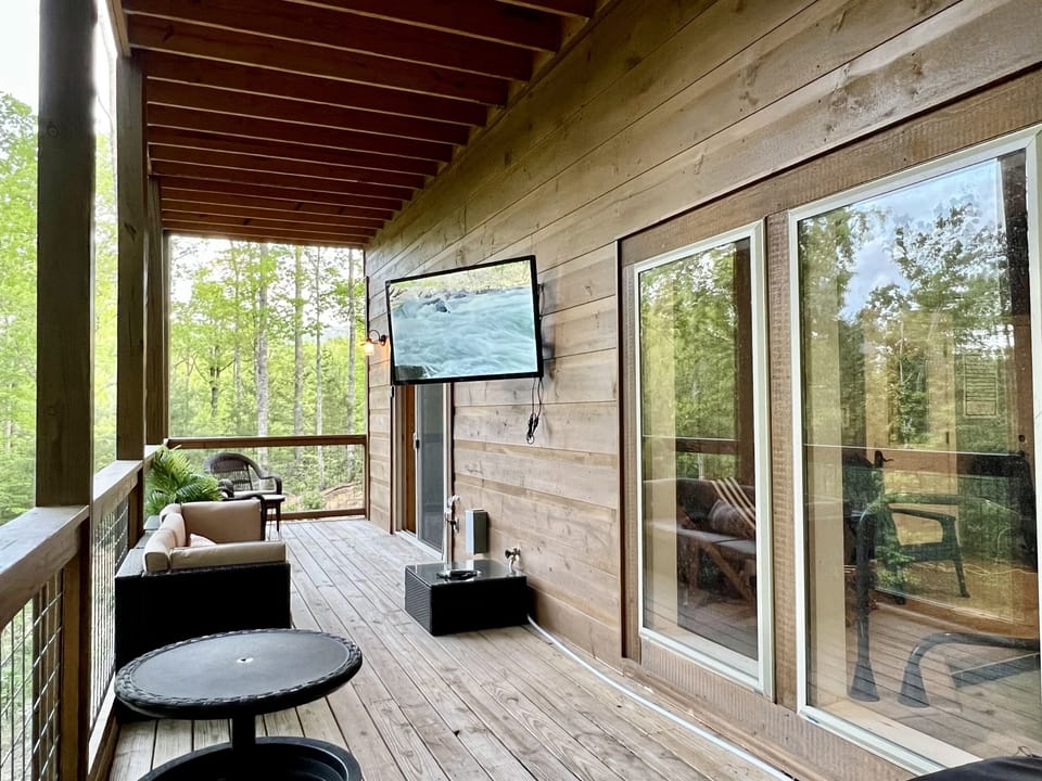 Relax in our large 8-person hot tub while enjoying a movie on our new 55” Outdoor TV