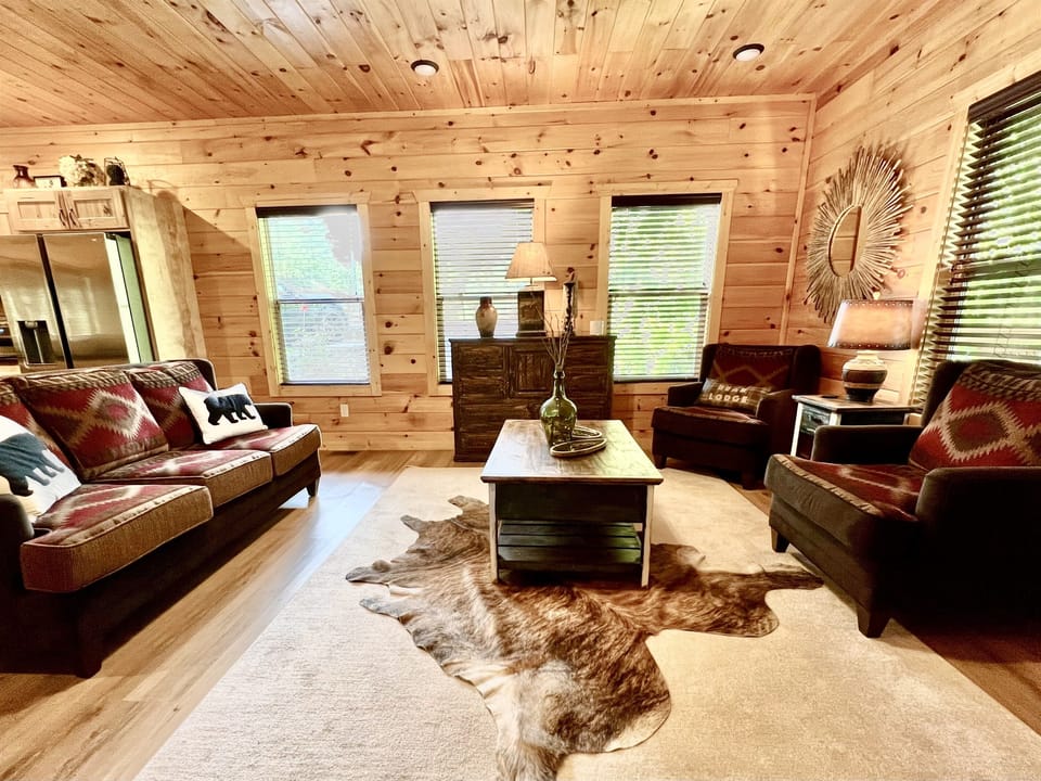Living room on main level with beautiful mountain lodge decor