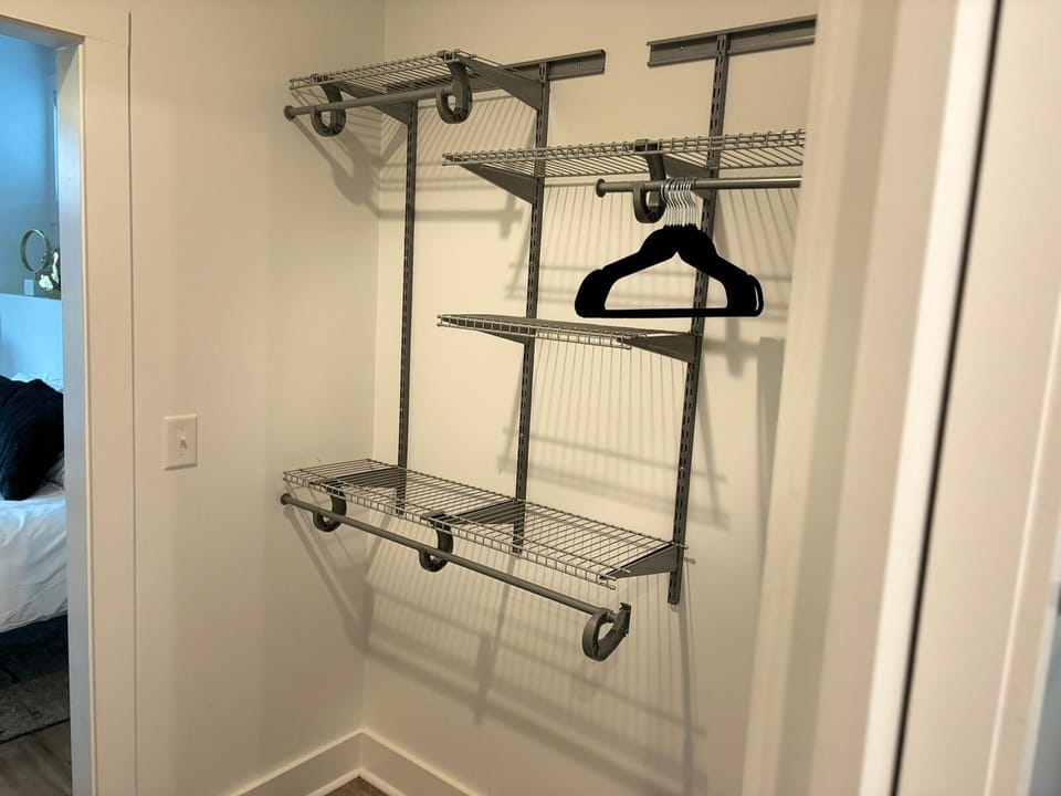 Spacious closet with adjustable shelving and plenty of hanging space.