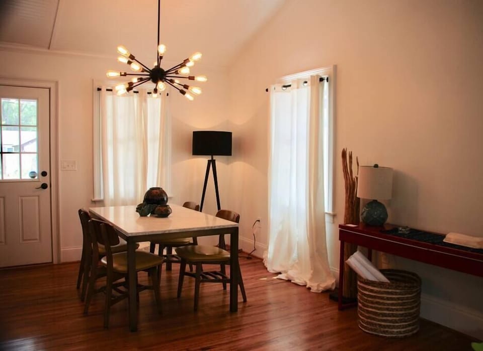 Bright sunlit dining room. Great space to eat, gather, and get work done! 