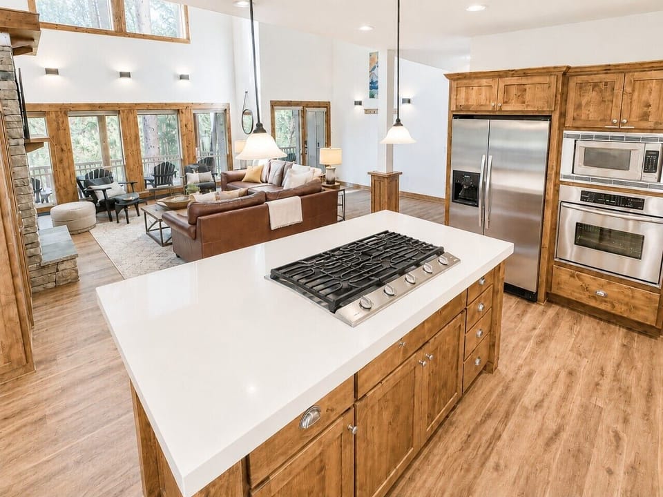 This bright, open-concept living area connects seamlessly to the kitchen and dining spaces, creating a warm and welcoming atmosphere for your stay