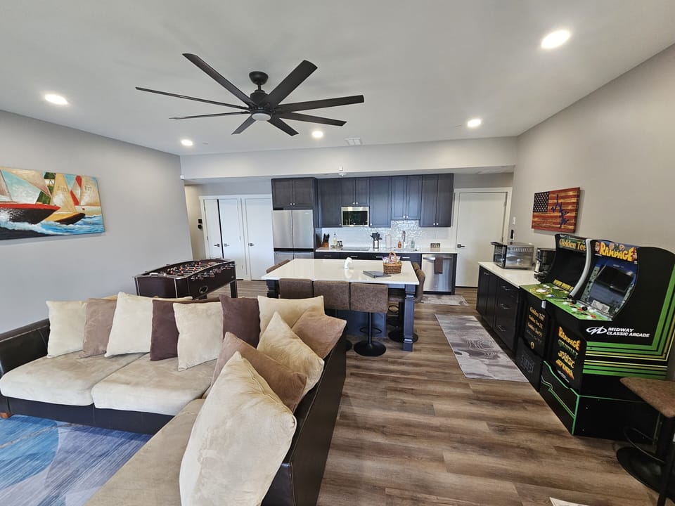 Main living space, kitchen and dining around kitchen island