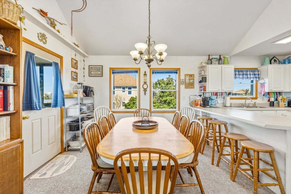 Enjoy meals together in the dining area, conveniently located next to the kitchen.