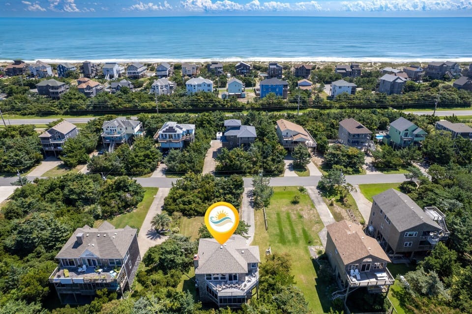 Aerial View: Aerial view showcasing Mad Hatteras' soundside location and proximity to the beach.