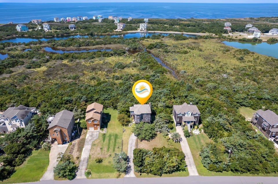 Aerial View: Aerial view showcasing Mad Hatteras' soundside location and proximity to the beach.