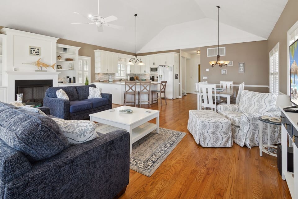 The spacious Living Area with a Flat Screen TV and views of the ocean is your dream home base!