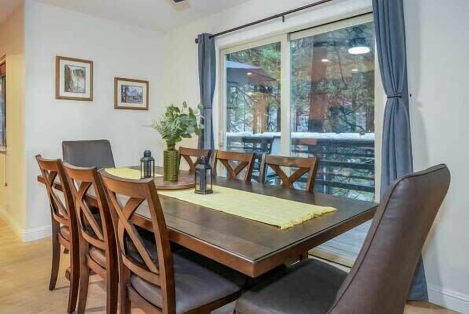 Large dining table. Additional bar seating is available. High chair for little ones is supplied. 