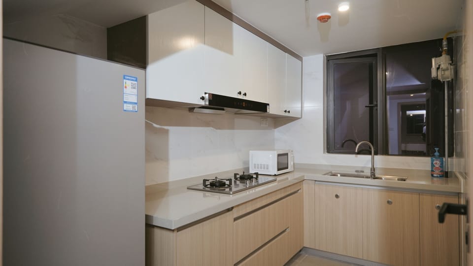 Family Suite, City View | Private kitchen | Fridge, microwave, stovetop, cookware/dishes/utensils