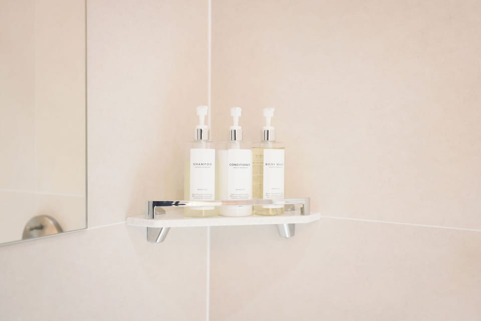 Designer toiletries, hair dryer, bathrobes, slippers
