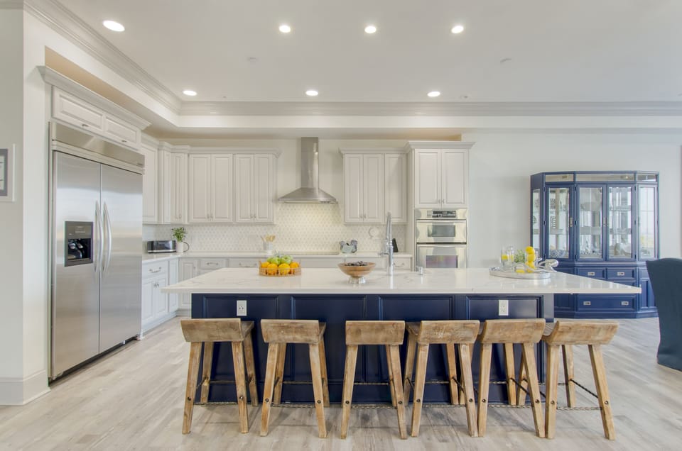 Additional barstool seating at the gourmet kitchen counter.