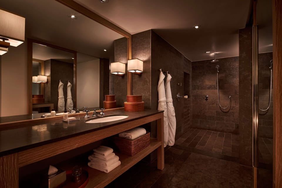 Designer toiletries, hair dryer, bathrobes, slippers