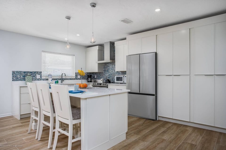 Fully renovated, high-end kitchen stocked with pots, pans & dishes.  (no food items)