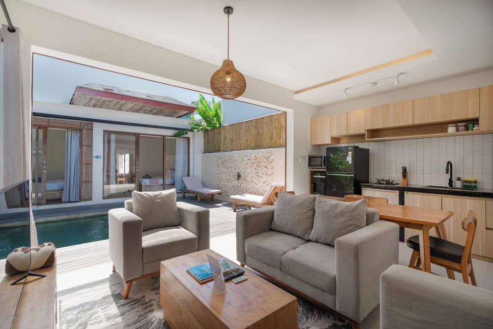 Deluxe Villa | Living room | 24-inch flat-screen TV with cable channels