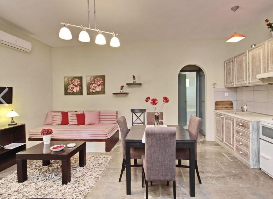 Deluxe Apartment, 1 Bedroom | Private kitchen | Fridge, coffee/tea maker, highchair