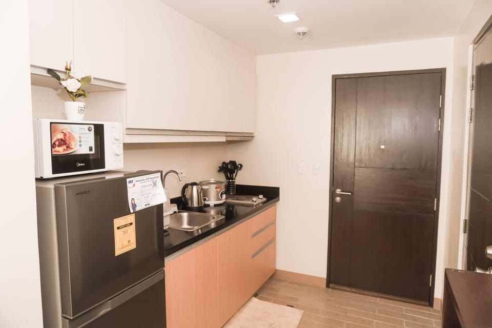 Exclusive Apartment | Private kitchen | Full-size fridge, microwave, oven, stovetop