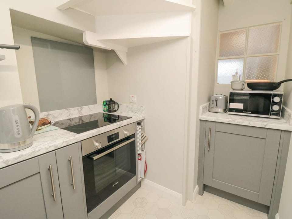 Fridge, electric kettle, toaster, cookware/dishes/utensils