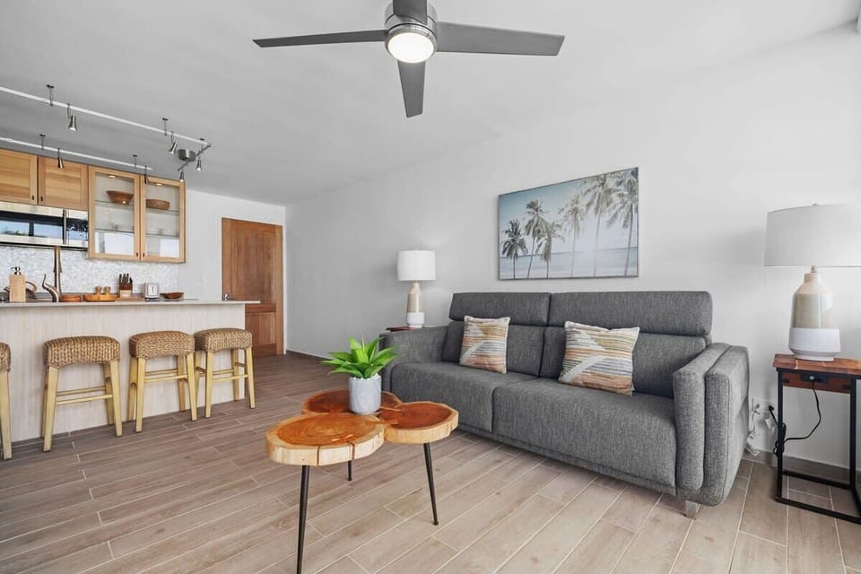 The living room and kitchen create a large social environment.