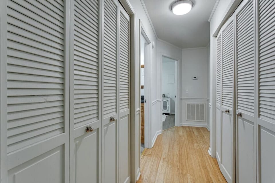The hallway that leads to the bedrooms. The washer and dryer are on the hallway.