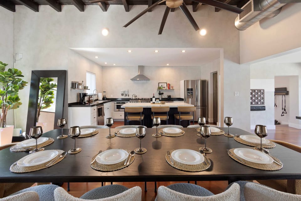 The dinner table fits 10 comfortably and 3 and the kitchen island!