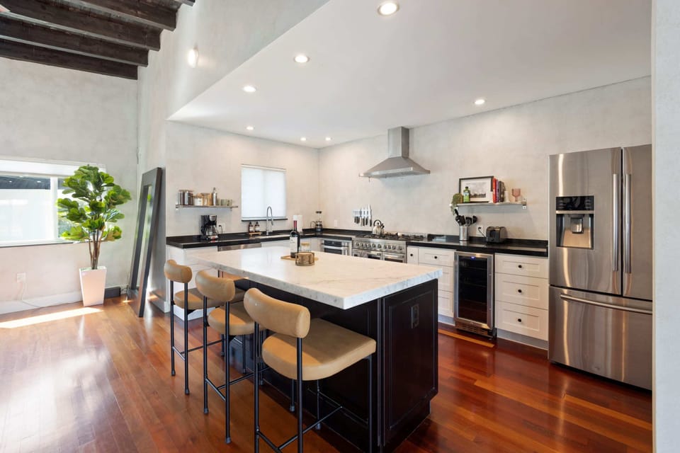The kitchen offers all cooking essentials and stainless steel appliances