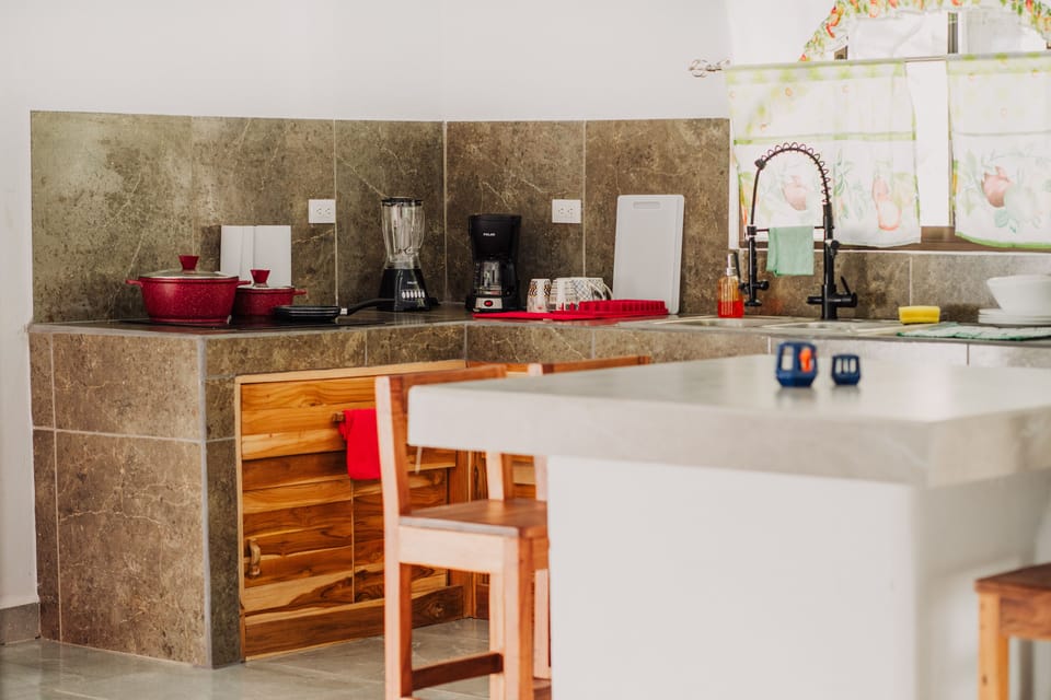Full-size fridge, stovetop, coffee/tea maker, highchair