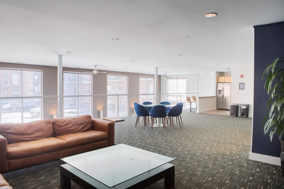 Exclusive resident clubroom featuring a game lounge and community kitchen for relaxing
