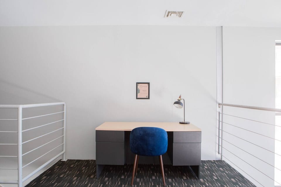 Exclusive resident clubroom featuring a game lounge and community kitchen for relaxing