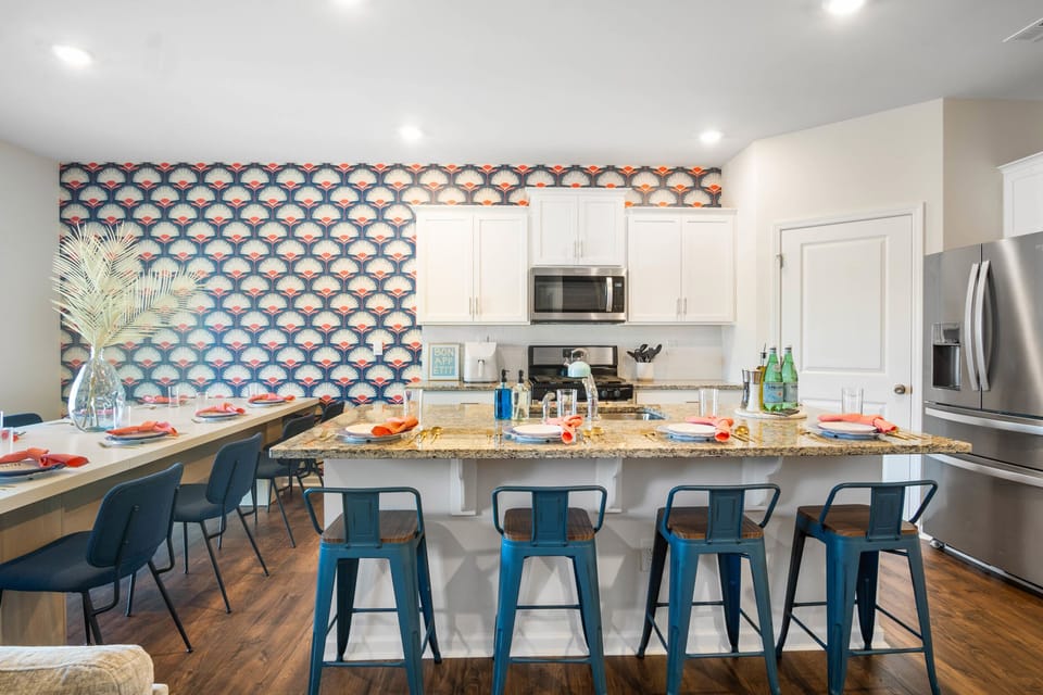 Kitchen island with bar stools for four, ideal for casual dining.