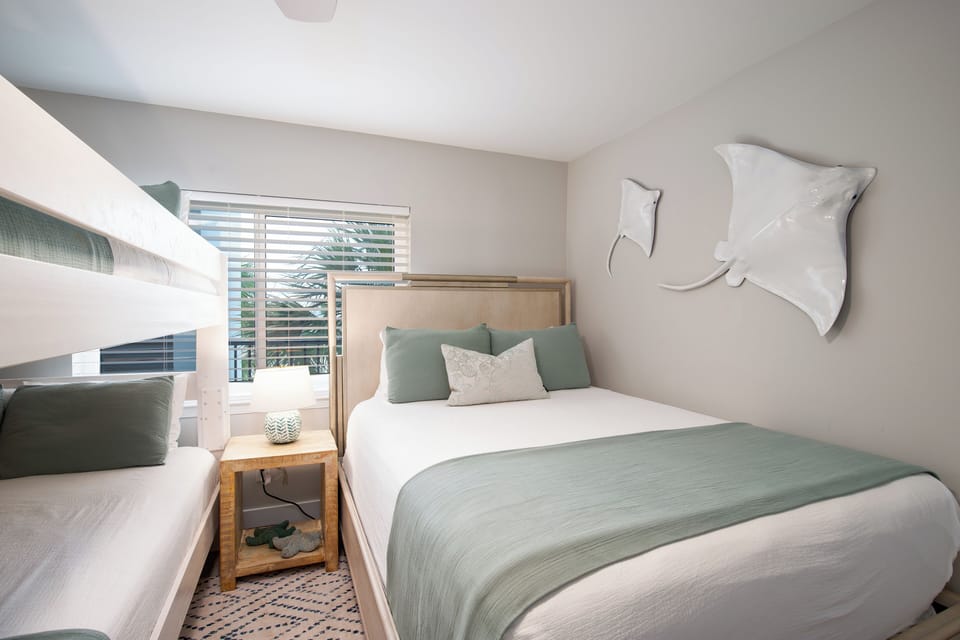 Guest Bedroom with a Queen over Queen Bunk Bed and Queen Bed