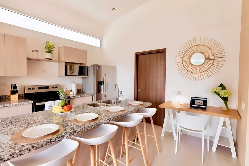 Stylish Kitchen With Modern Appliances And A Spacious Dining Space