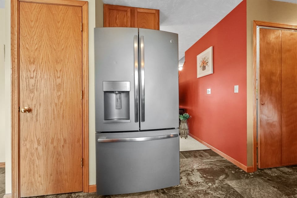 Kitchen Delight: Modern appliances await your culinary adventures in a vibrant, welcoming space!