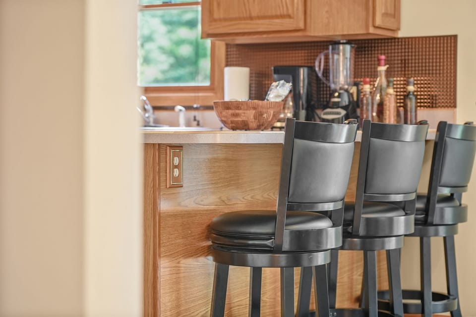 Breakfast Bar: Sip your coffee while enjoying views in this stylish eat-in kitchen!