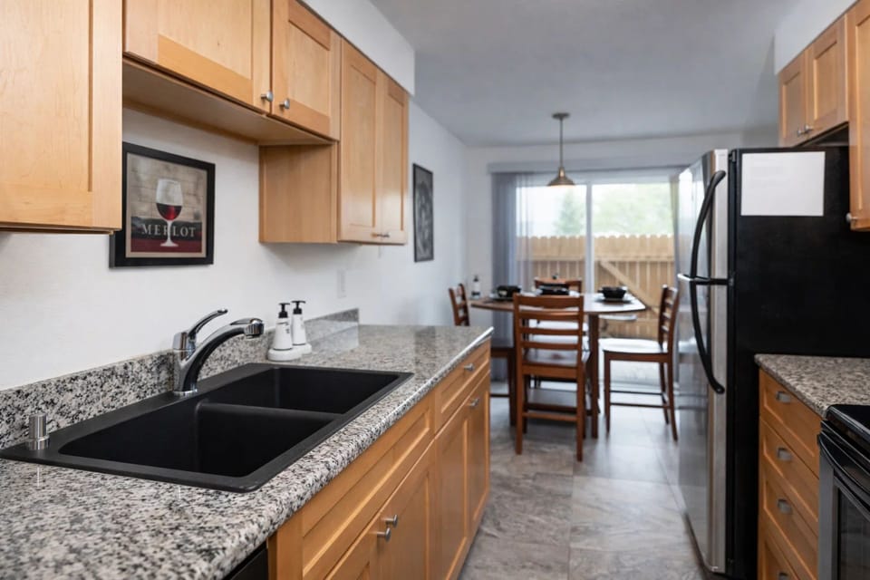 Kitchen: Enjoy a stylish space with modern appliances and a charming dining nook for meals together!