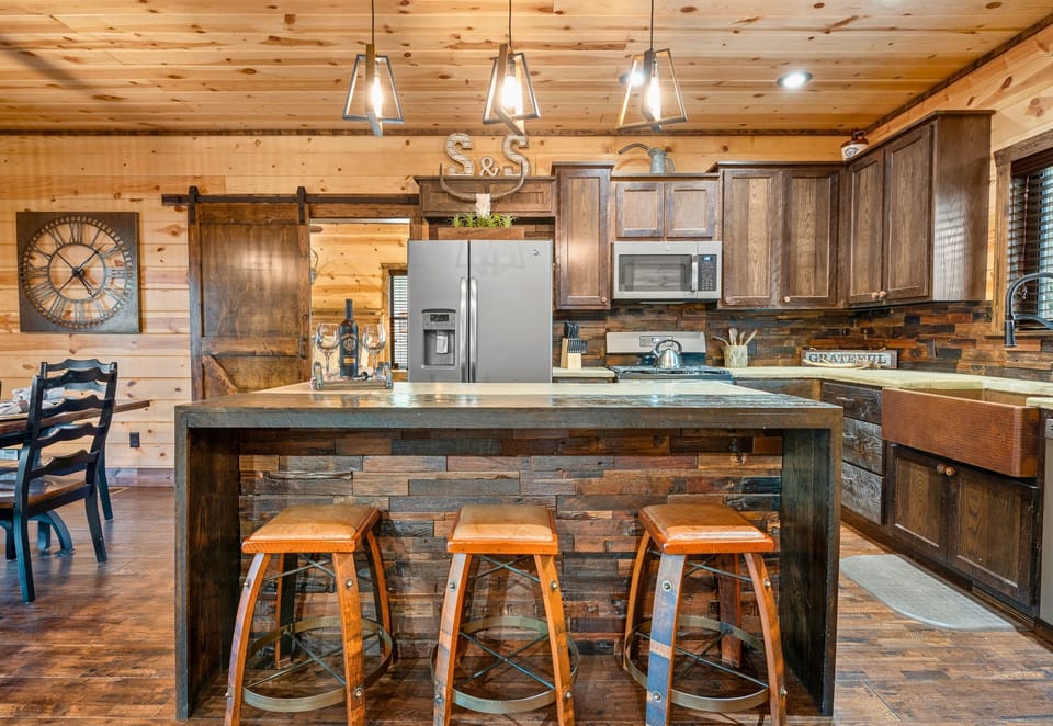 Indulge in the warmth of our inviting kitchen, where rustic meets elegance, and every corner is a promise of comfort