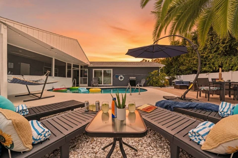 Sun, shade & serenity—loungers, hammock & poolside seating for your dream family-friendly getaway in Largo, FL.  #PoolsideVibes #FamilyVacation #FloridaStay