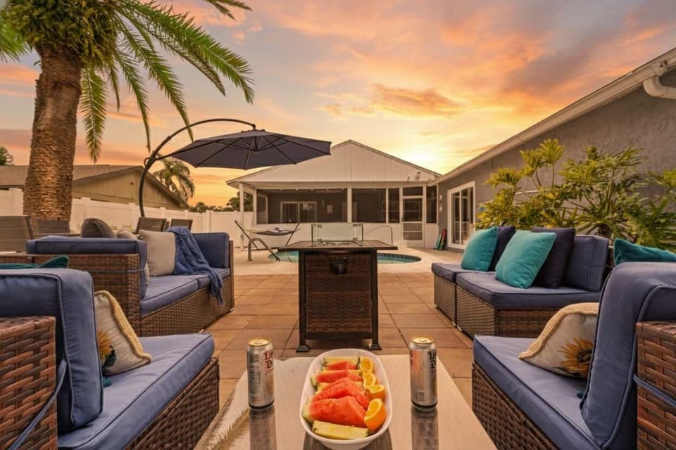 Gather around the fire table with family, snacks & laughter. Perfect for making long-lasting memories under Florida’s colorful skies.  #FamilyTime #VacationRental #LargoGetaway