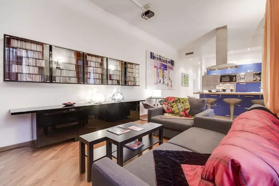 Superior Apartment | Living area | Books, stereo