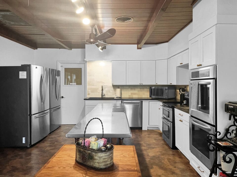 Modern elegance meets functionality in our spacious, fully stocked kitchen remodel.