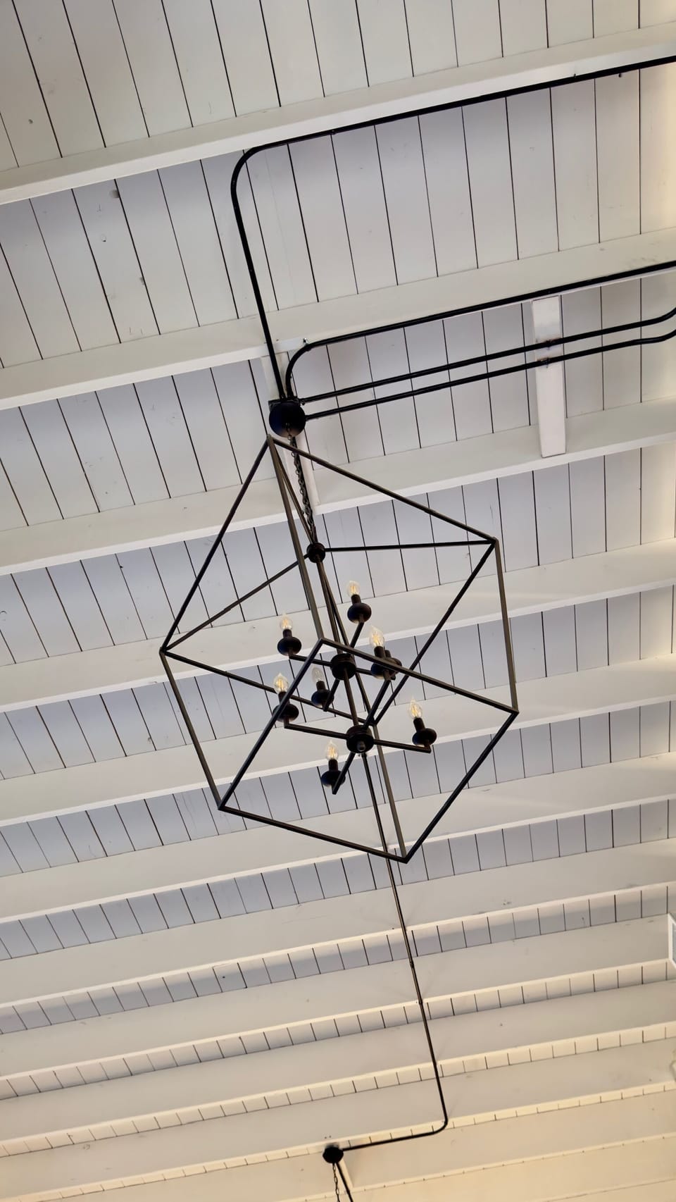 Exposed beam ceiling with unique lighting