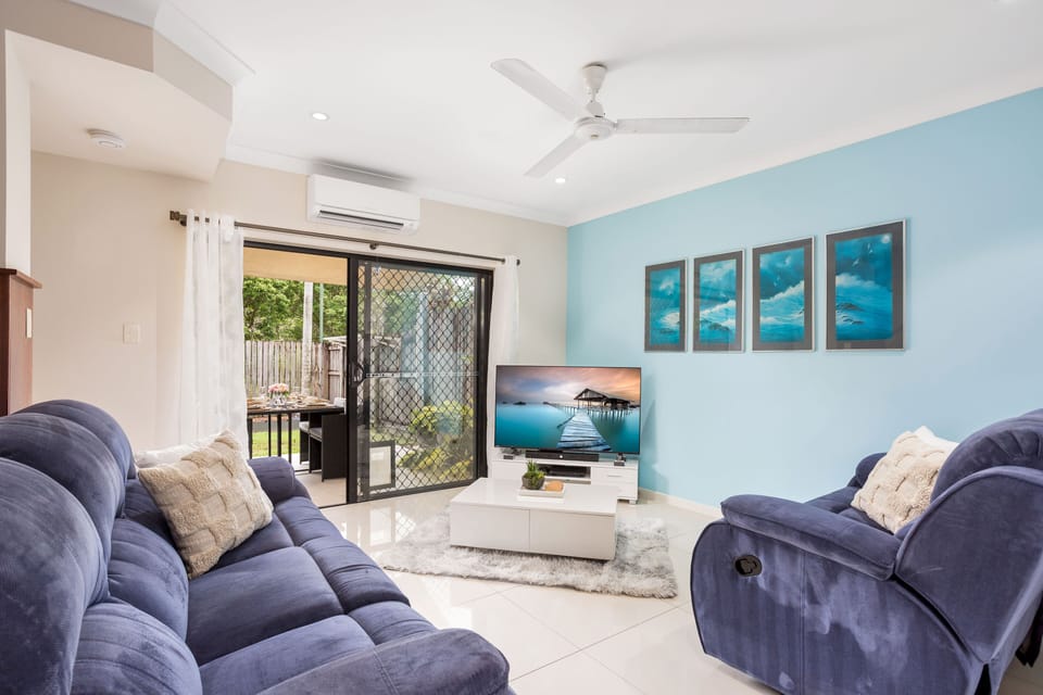Comfort Apartment | Living area | 55-inch Smart TV with cable channels, Netflix, streaming services