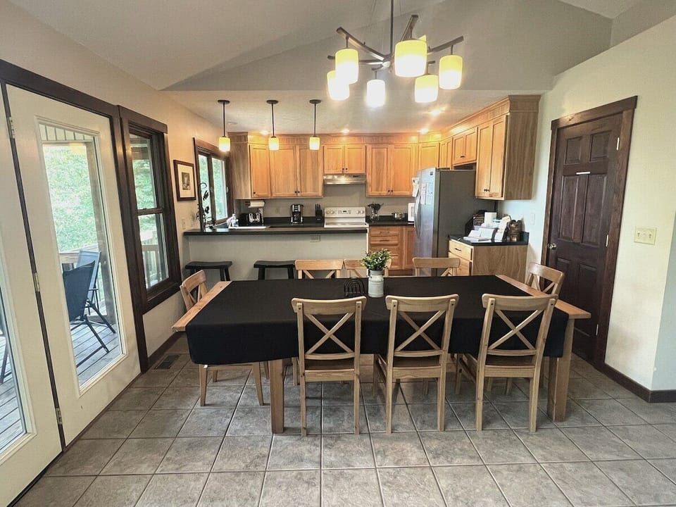 Dining & kitchen view from the living room - deck is pictured on the left 