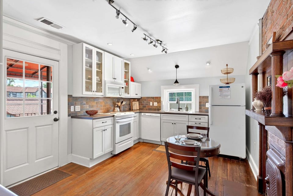 Kitchen with eat-in dining for 2, a dishwasher, and a standard drip-style coffeemaker.